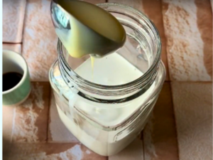 Step-by-Step Instructions for Making French Vanilla Coffee at Home - Step 2 Add Condensed Milk and Vanilla Essence