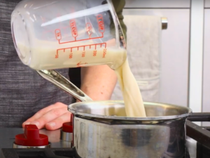 steam 1 cup of milk using a milk frother or on the stove