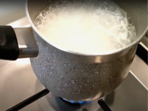 steam 1 ounce of milk using a milk frother